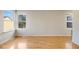 Bright bedroom featuring hardwood floors and natural lighting at 10329 W Fair Ave # C, Littleton, CO 80127
