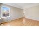 Bedroom featuring hardwood floors, natural lighting, and neutral colors at 10329 W Fair Ave # C, Littleton, CO 80127