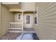Exterior entry with a covered porch and white trim, showcasing a welcoming entrance at 10329 W Fair Ave # C, Littleton, CO 80127