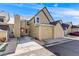 Attractive townhome featuring attached garages and neutral exterior paint at 10329 W Fair Ave # C, Littleton, CO 80127