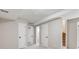 Hallway with several doors, neutral walls, and carpet at 10329 W Fair Ave # C, Littleton, CO 80127