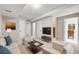 Cozy living room featuring a plush sofa, accent chairs, and modern decor at 10329 W Fair Ave # C, Littleton, CO 80127