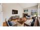 Cozy living room with high ceilings, a fireplace, comfortable seating, and stylish decor for a warm atmosphere at 10329 W Fair Ave # C, Littleton, CO 80127