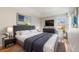 Comfortable bedroom features a modern design with a view of the neighborhood out the window at 10329 W Fair Ave # C, Littleton, CO 80127
