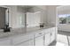 Bathroom with double vanity, quartz countertop, and large mirror at 27492 E 1St Ave, Aurora, CO 80018