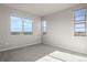 Bedroom with three windows and neutral carpeting, providing natural light at 27492 E 1St Ave, Aurora, CO 80018
