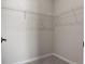 Walk-in closet featuring wire shelving, a plush carpeted floor, and white walls offering an adaptable storage solution at 27492 E 1St Ave, Aurora, CO 80018