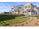 Charming townhome with well-manicured lawn and wrought iron fencing at 27492 E 1St Ave, Aurora, CO 80018