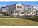 Attractive townhomes with a black metal fence and lush green lawn in a well-maintained community at 27492 E 1St Ave, Aurora, CO 80018