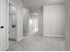 Spacious hallway with carpet floors, multiple doorways, and neutral color tones for a calming ambiance at 27492 E 1St Ave, Aurora, CO 80018