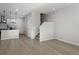 Spacious living room area with an open-concept design, hardwood floors and stairway access at 27492 E 1St Ave, Aurora, CO 80018