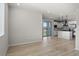 Spacious living room with sleek wood floors, recessed lighting, and an open concept design at 27492 E 1St Ave, Aurora, CO 80018