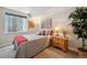 Cozy bedroom featuring a comfortable bed, soft lighting, and stylish decor, perfect for relaxation at 15569 W La Salle Ave, Lakewood, CO 80228