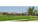 Scenic view of the community park with a well-maintained tennis court at 15569 W La Salle Ave, Lakewood, CO 80228