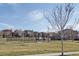 Community park with a tennis court, tree, and picturesque views of the surrounding houses at 15569 W La Salle Ave, Lakewood, CO 80228