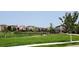 Scenic view of the community park with a well-maintained tennis court at 15569 W La Salle Ave, Lakewood, CO 80228
