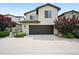 Beautiful two-story home with a well-maintained front yard and a spacious two-car garage at 15569 W La Salle Ave, Lakewood, CO 80228