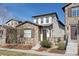 Charming two-story home featuring stone accents, a well-maintained lawn, and a welcoming front entrance at 15569 W La Salle Ave, Lakewood, CO 80228