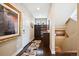 Hallway with hardwood floors, stairway and convenient built-in shelves and coat rack at 15569 W La Salle Ave, Lakewood, CO 80228