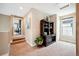 Hallway featuring carpet flooring, a built-in hutch, a window for natural light, and an open doorway at 15569 W La Salle Ave, Lakewood, CO 80228