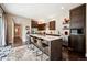 Modern kitchen with stainless steel appliances, a large island, and stylish bar stools at 15569 W La Salle Ave, Lakewood, CO 80228