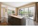 Spacious kitchen island with seating and sliding glass doors leading to an outdoor patio at 15569 W La Salle Ave, Lakewood, CO 80228