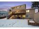 Two story home with deck and snowy backyard at 10350 W Burgundy Ave, Littleton, CO 80127