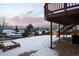 Deck overlooking snowy backyard and mountains at 10350 W Burgundy Ave, Littleton, CO 80127