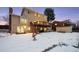 Two story home with deck and snowy backyard at 10350 W Burgundy Ave, Littleton, CO 80127