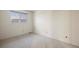 Carpeted bedroom with window and mountain view at 10350 W Burgundy Ave, Littleton, CO 80127