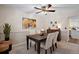 Dining area with a wooden table and chairs, and view into kitchen at 10350 W Burgundy Ave, Littleton, CO 80127