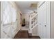 Bright entryway with hardwood floors, coat closet and staircase at 10350 W Burgundy Ave, Littleton, CO 80127