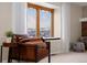 Living room features window seat with mountain views at 10350 W Burgundy Ave, Littleton, CO 80127