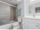 The bathroom features a shower and bathtub combo and updated vanity at 2014 S Pagosa St, Aurora, CO 80013