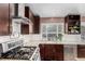 Updated kitchen with stainless steel appliances, granite countertops, and subway tile backsplash at 2014 S Pagosa St, Aurora, CO 80013