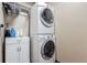 Laundry room with stacked washer and dryer at 2014 S Pagosa St, Aurora, CO 80013