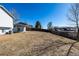 Large backyard with a covered patio area, ready for landscaping and outdoor enjoyment at 4752 E 108Th Pl, Thornton, CO 80233