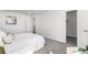 Bright bedroom featuring neutral walls, soft carpet, and a walk-in closet for ample storage at 4752 E 108Th Pl, Thornton, CO 80233
