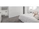 Cozy bedroom featuring soft carpet, white walls and a seating area by the window at 4752 E 108Th Pl, Thornton, CO 80233