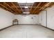 Spacious garage with high ceilings, exposed beams, and an unfinished workbench at 4752 E 108Th Pl, Thornton, CO 80233