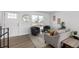 Bright living room with modern decor, neutral color palette, and wood floors at 4752 E 108Th Pl, Thornton, CO 80233