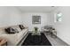 Cozy living room with a modern design, comfortable seating, and a graphic art piece at 4752 E 108Th Pl, Thornton, CO 80233
