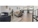 Open-concept living room and dining area, with wood floors at 4752 E 108Th Pl, Thornton, CO 80233