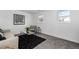 Bright living room featuring stylish decor, neutral colors, and multiple windows at 4752 E 108Th Pl, Thornton, CO 80233