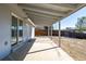 Back porch and backyard with a lawn that needs TLC at 4752 E 108Th Pl, Thornton, CO 80233
