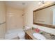 Bathroom features vanity with granite countertop, shower-tub combo, and tile floor at 483 S Kingston Cir, Aurora, CO 80012