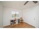 Cozy bedroom featuring a closet, natural light, and wood flooring at 483 S Kingston Cir, Aurora, CO 80012