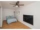 Bedroom features laminate floors, ceiling fan and board for creative activities at 483 S Kingston Cir, Aurora, CO 80012