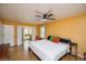 Spacious primary bedroom with ensuite bathroom, ceiling fan, and two closets with double doors at 483 S Kingston Cir, Aurora, CO 80012