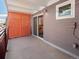 Wide balcony featuring an orange metal privacy screen with a sliding glass door to indoor space at 1495 Vrain St # 214, Denver, CO 80204